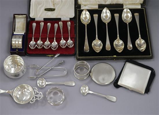 Two cased sets of six silver spoons and other small silver items including napkin rings, strainer etc.